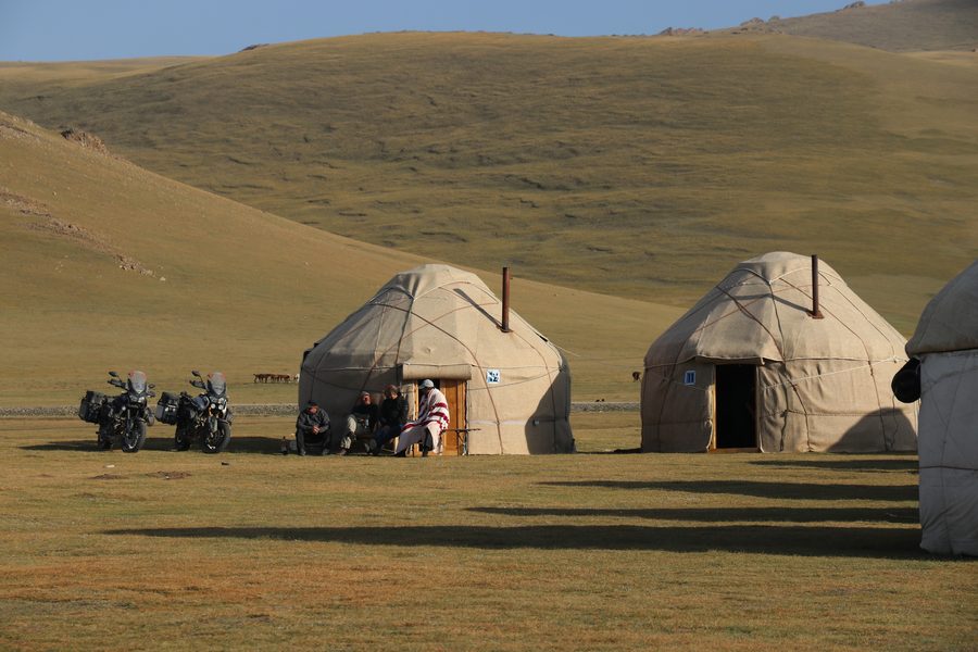 Yurt camp with adventure motorbikes on Kyrgyz steppe, Kyrgyzstan