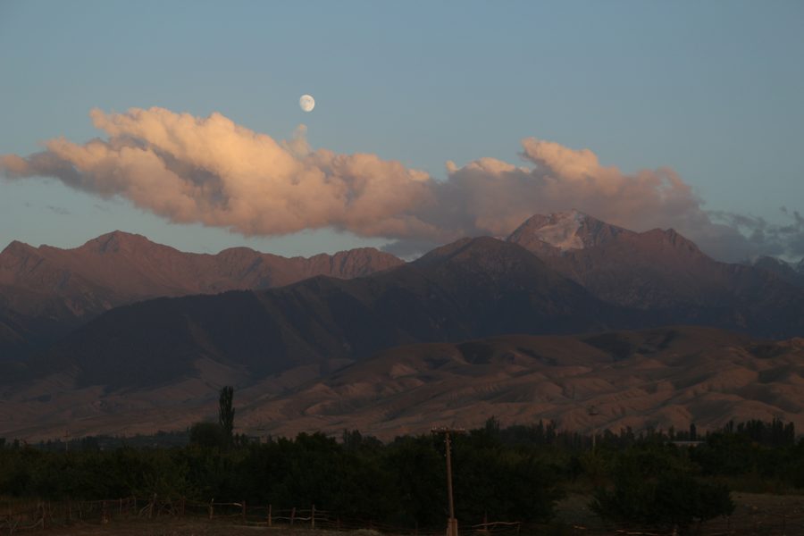 Moon rising over Tian Shan mountains at dusk, Kyrgyzstan