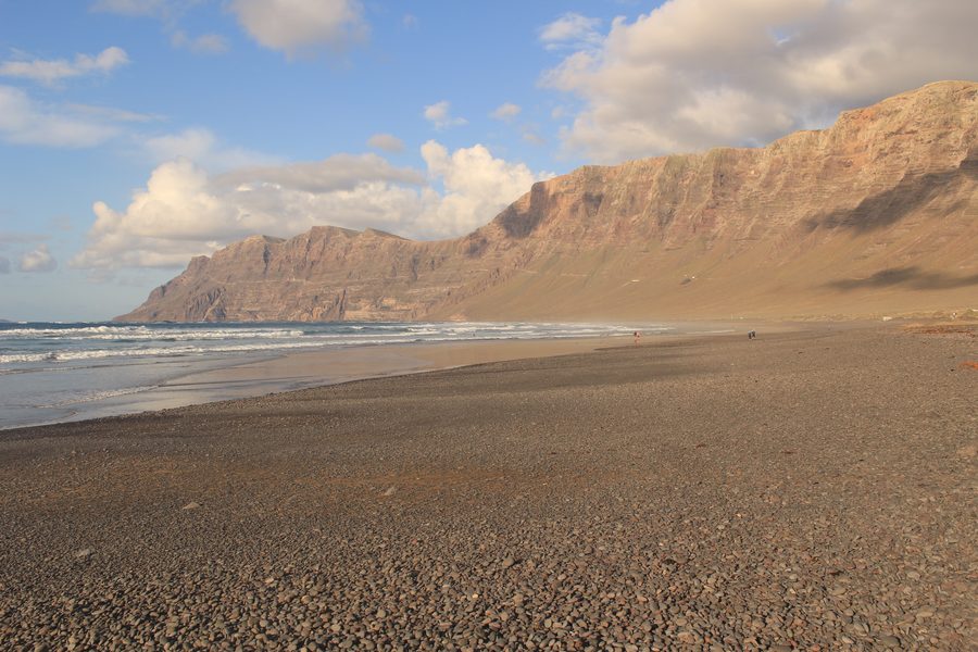 Famara beach with dramatic cliffs and Atlantic waves, Lanzarote, Spain