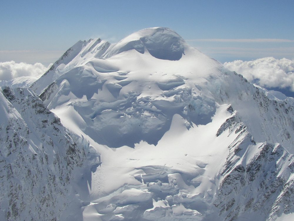 Snow-capped peaks above the clouds, Southern Alps, New Zealand